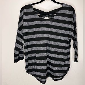 Off brand black and silver stripped blouse size L with cris cross back